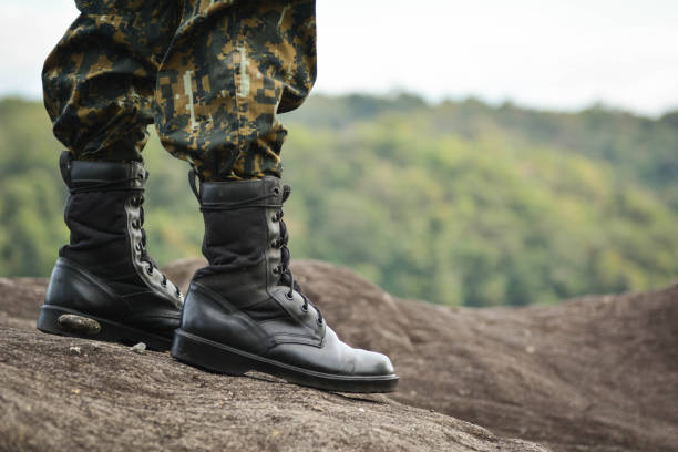 istock Low Section Of Solider Standing On Rock 726896395