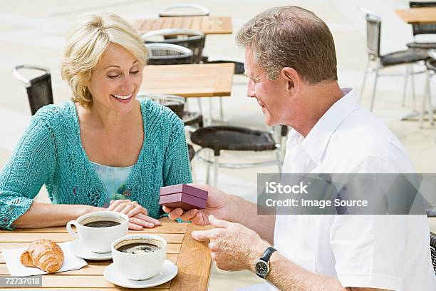 Man Giving Gift To Wife Stock Photo - Download Image Now - Adult, Adults Only, Box - Container