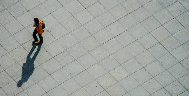 istock High Angle View Of Man Walking On Pedestrian Zone 728909041