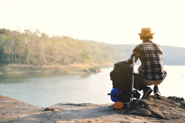 istock Rear View Of Man On Shore Against Sky 730261253