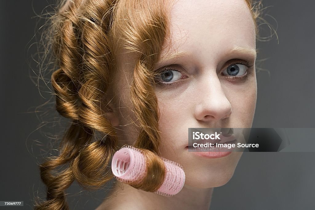 Young woman with hair in ringlets - Стоковые фото Бигуди роялти-фри