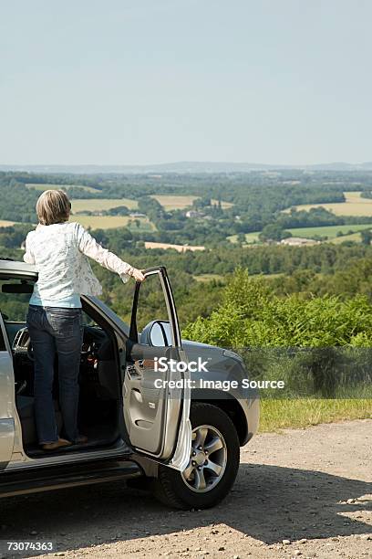 Woman Looking At View From Her Car Stock Photo - Download Image Now - Active Seniors, Adults Only, Adventure