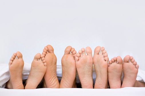 girl sits with her feet on the table, women's feet on the table, rest