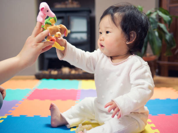 istock Close-Up Of Boy Playing With Finger Puppets 731847587