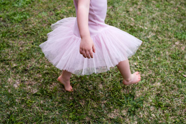 istock Low Section Of Girl Walking On Field 731851643