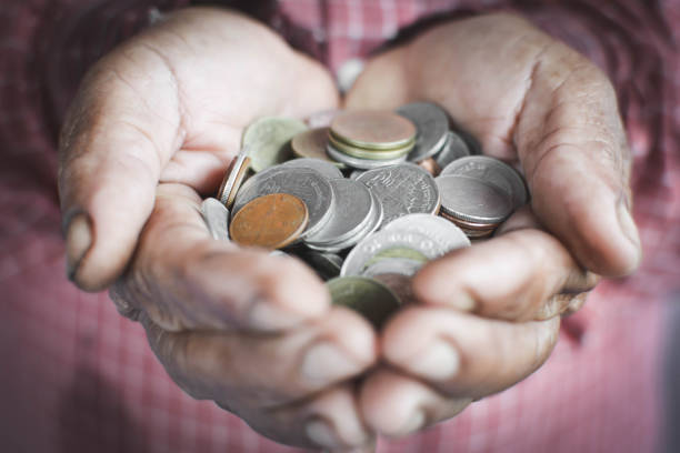 istock Midsection Of Man Holding Coins 731859123