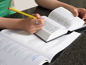 Student with dictionary and textbook