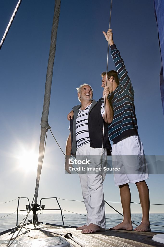 Father and son sailing  Family Stock Photo