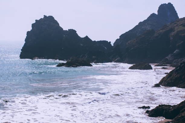 istock Rock Formation In Sea Against Clear Sky 732723761
