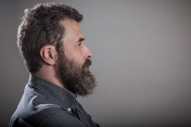 istock Side View Of Bearded Man Against Gray Background 732740915