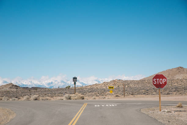 istock Road Sign Against Clear Blue Sky 733516943