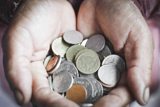 istock Cropped Hands Of Man Holding Coins 733522051