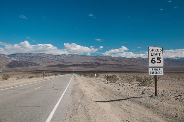 istock Road Sign On Landscape Against Sky 733526847