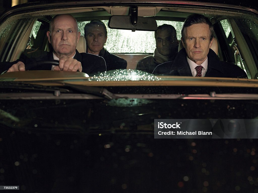 Cuatro empresarios sentado en coche - Foto de stock de Coche libre de derechos