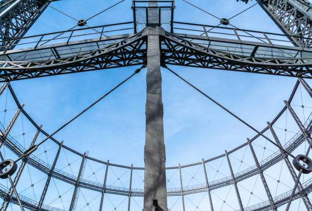 istock Low Angle View Of Gasometer Against Blue Sky 735960213