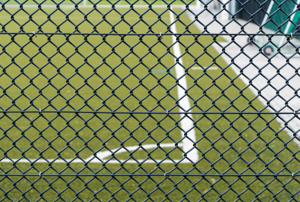 istock Soccer Field Seen Through Chainlink Fence 735961403