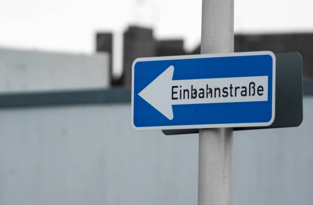 istock Low Angle View Of One Way Sign With Text On Pole 735962083