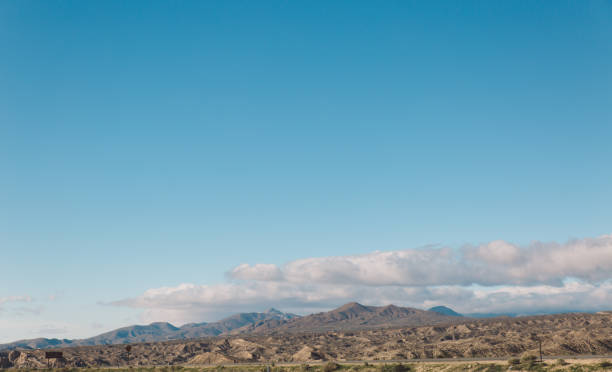 istock Scenic View Of Mountains Against Clear Blue Sky 736028041