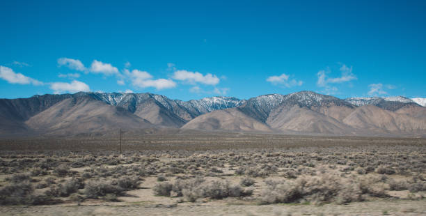 istock Scenic View Of Mountains Against Blue Sky 736053741
