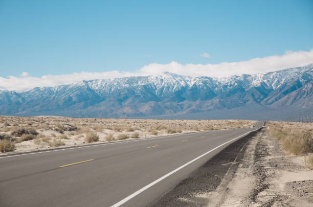 istock Road By Mountains Against Sky During Winter 736058433