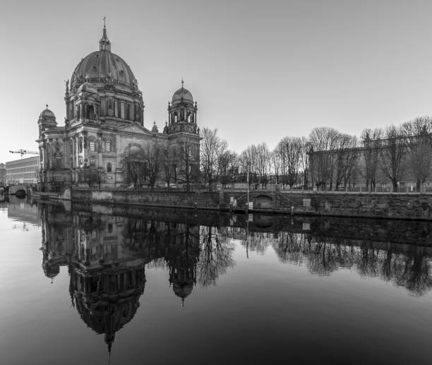 istock Reflection Of Berlin Cathedral On Spree River Against Clear Sky 736511313