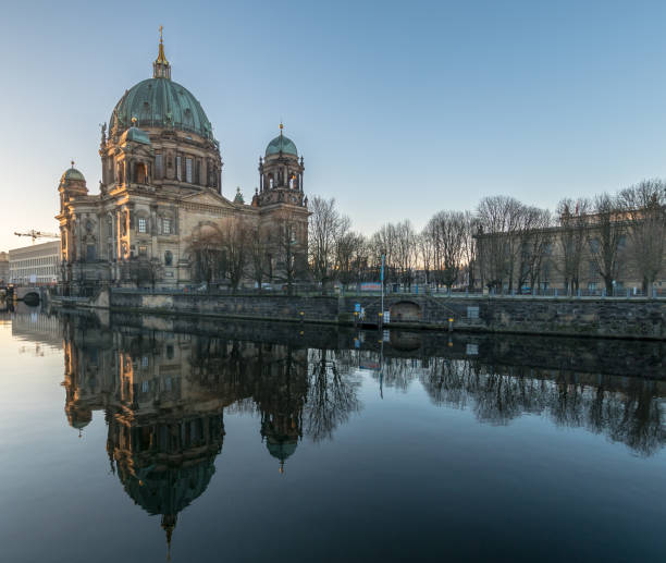 istock Reflection Of Berlin Cathedral On Spree River Against Clear Sky 736512115