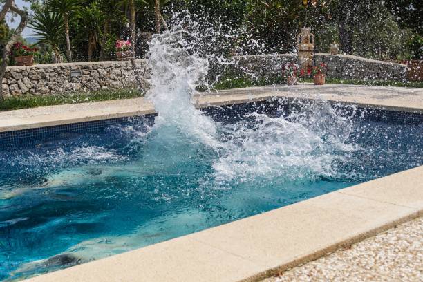 istock Water Splashing In Swimming Pool At Resort 736516253
