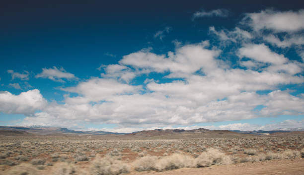 istock Scenic View Of Desert Against Blue Sky 736533363