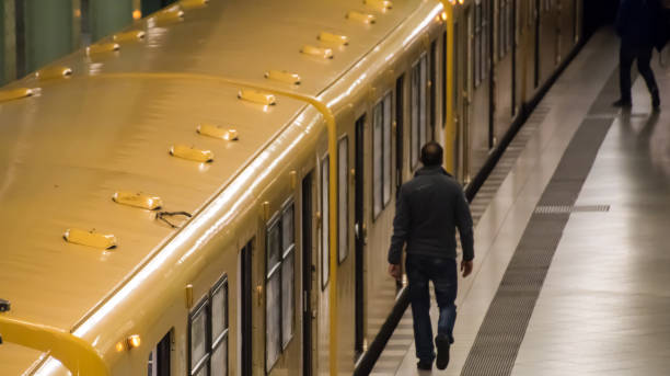 istock High Angle View Of Man Walking By Train At Subway Station 736840841