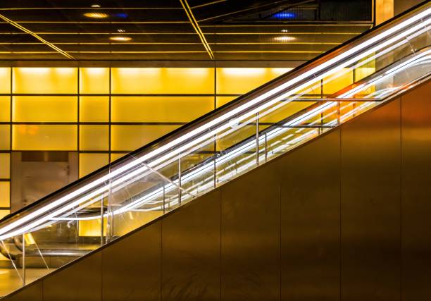 istock Illuminated Railings Of Escalators At Subway Station 736842865