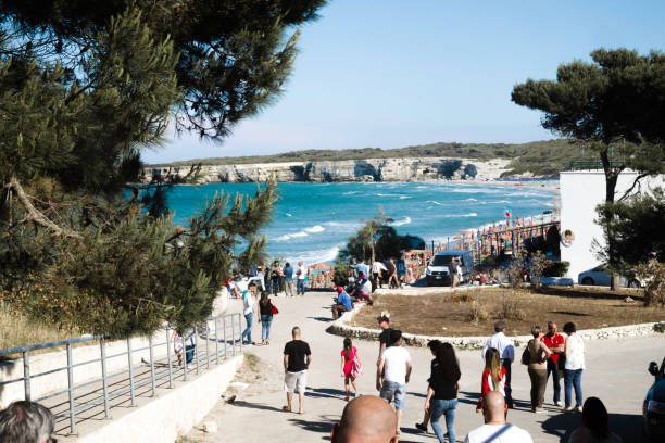 istock People Walking On Footpath Near Sea During Sunny Day 739244485