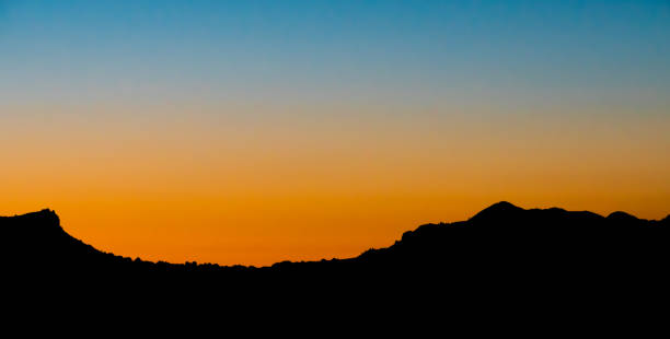 istock Silhouette Landscape Against Clear Sky During Sunset 740687333