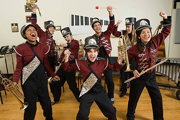 Excited band  cheering group of people success looking at camera stock pictures, royalty-free photos & images