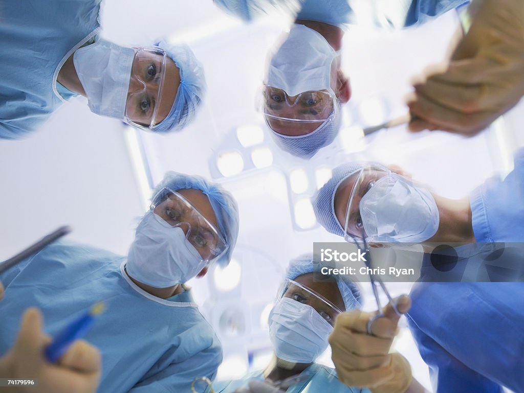 Low level view of surgical team operating  Doctor Stock Photo