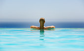 Woman in infinity pool