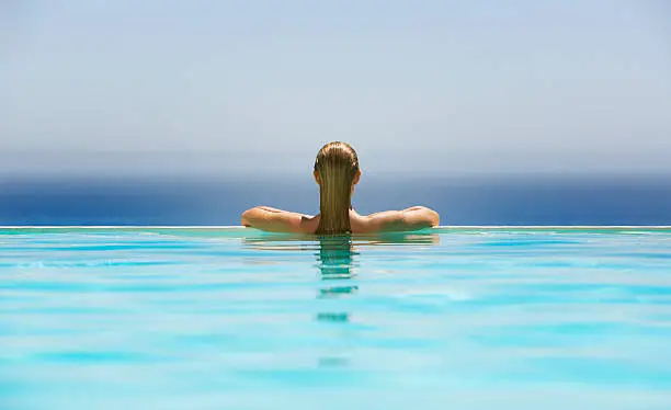 Photo of Woman in infinity pool