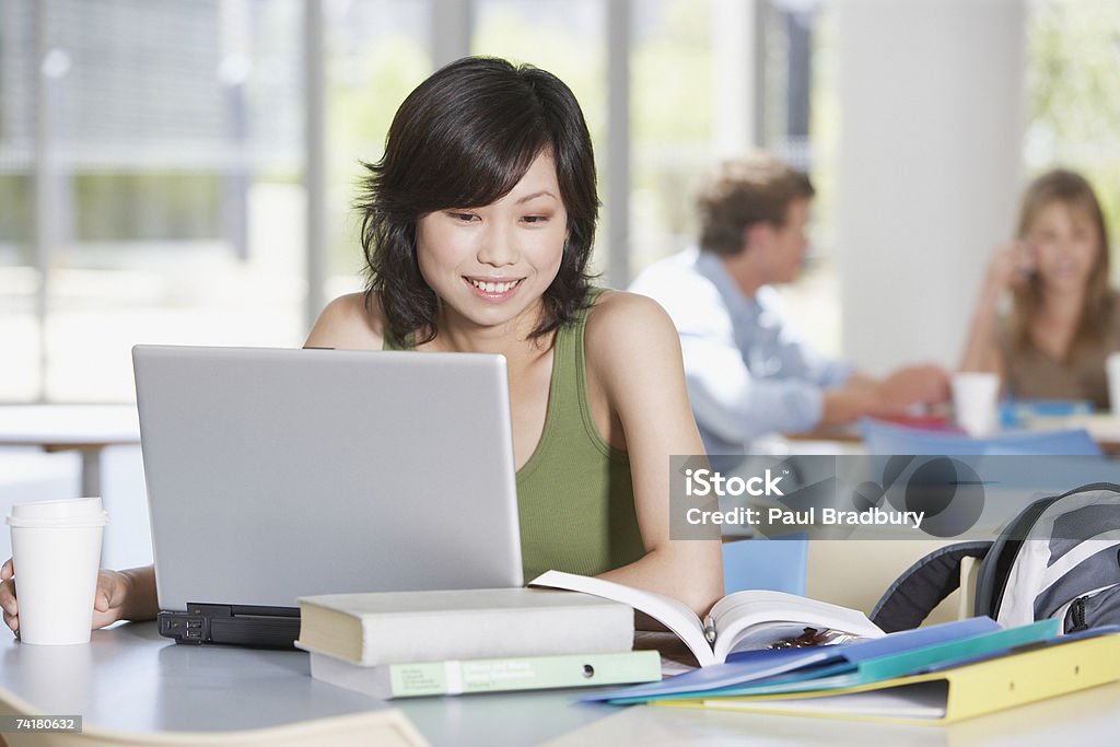 Young woman with laptop and books at school  20-24 Years Stock Photo