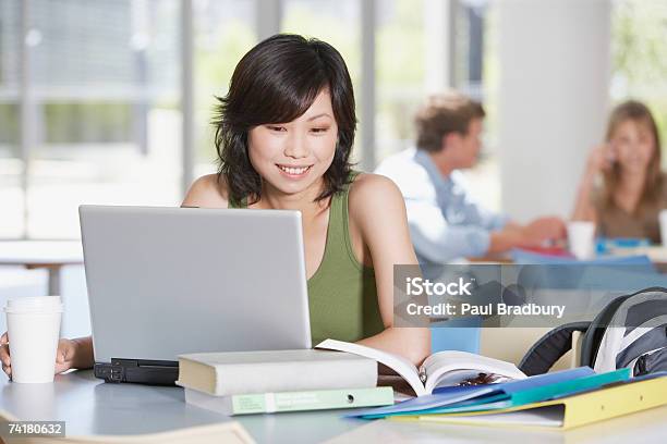 Young Woman With Laptop And Books At School Stock Photo - Download Image Now - 20-24 Years, Adults Only, Book