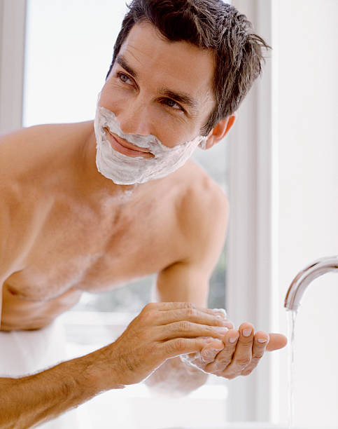 Man shaving  shaving stock pictures, royalty-free photos & images