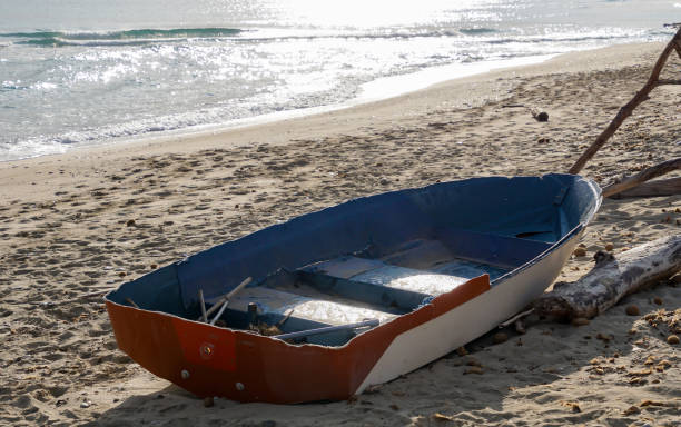 istock Boat Moored On Sand At Beach During Sunny Day 742257857