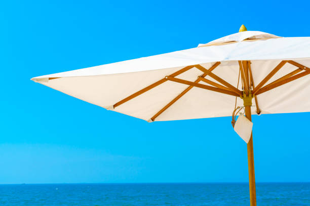 istock Low Angle View Of Umbrella Against Clear Blue Sky 742291119