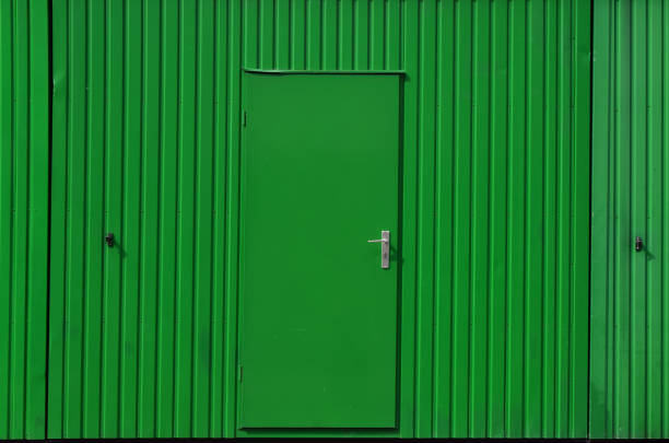 a picture of a Bright green door on a white brick house