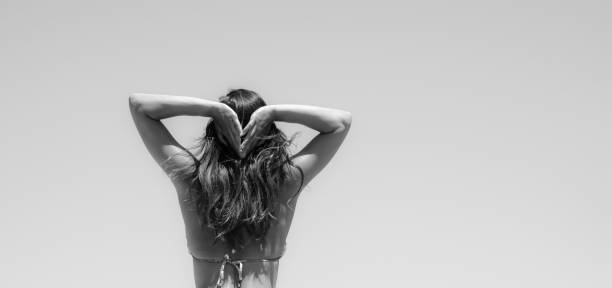 istock Rear View Of Woman Against White Background 743734607