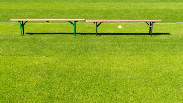 istock Empty Wooden Bench On Sports Field 743742035