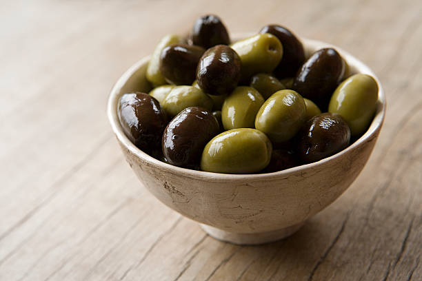 Bowl of olives  green olive fruit stock pictures, royalty-free photos & images
