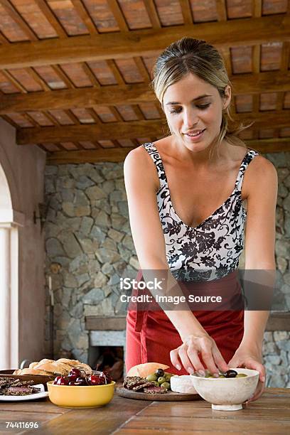 Woman Preparing Appetizers — стоковые фотографии и другие картинки Только одна женщина - Только одна женщина, Повар, Черешня