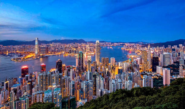 istock High Angle View Of City Lit Up Against Blue Sky 746076305