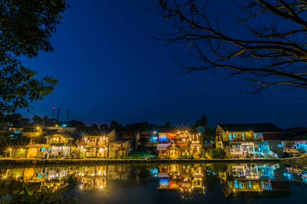 istock River By Illuminated City Against Clear Blue Sky At Night 746110143