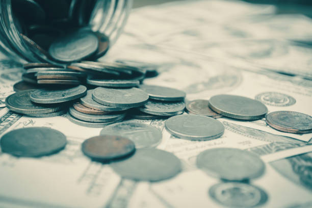 istock Close-Up Of Coins And Currency 748581243