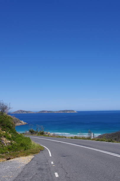 istock Road By Sea Against Clear Blue Sky 748610899